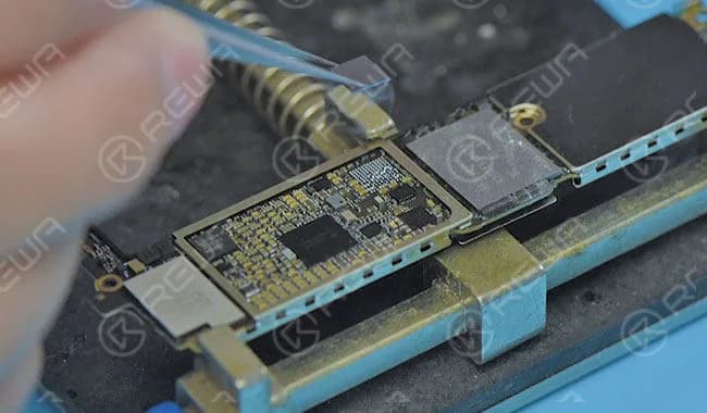 Apply some BGA paste flux around the audio IC and blow it with hot air gun at 300 degrees. Then take down the audio IC.