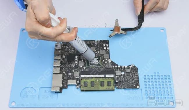Apply some thermal paste and install heat sink.