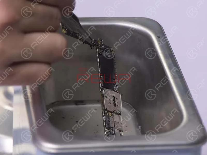 Detach the shielding cover from the board with Hot Air Gun and scrub shielding paster off the board. Pour adequate PCB Cleaner into the Ultrasonic Cleaner. Then put the logic board in. Press the power button to power on. The Ultrasonic Cleaner will then start to work. Take out the logic board after 15 minutes.
