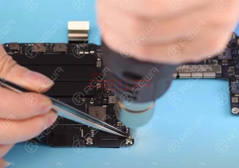 Detach C6990 first. Apply some BGA Paste Flux and detach C6990 with Hot Air Gun at 430℃. Clean with PCB Cleaner after the logic board has cooled enough.