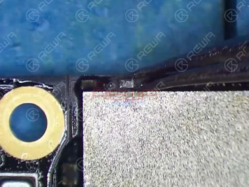 Let’s try to detach C2649 from the board and see how it works. Remove black adhesive around C2649 first. Then we can just remove it with tweezers slightly.