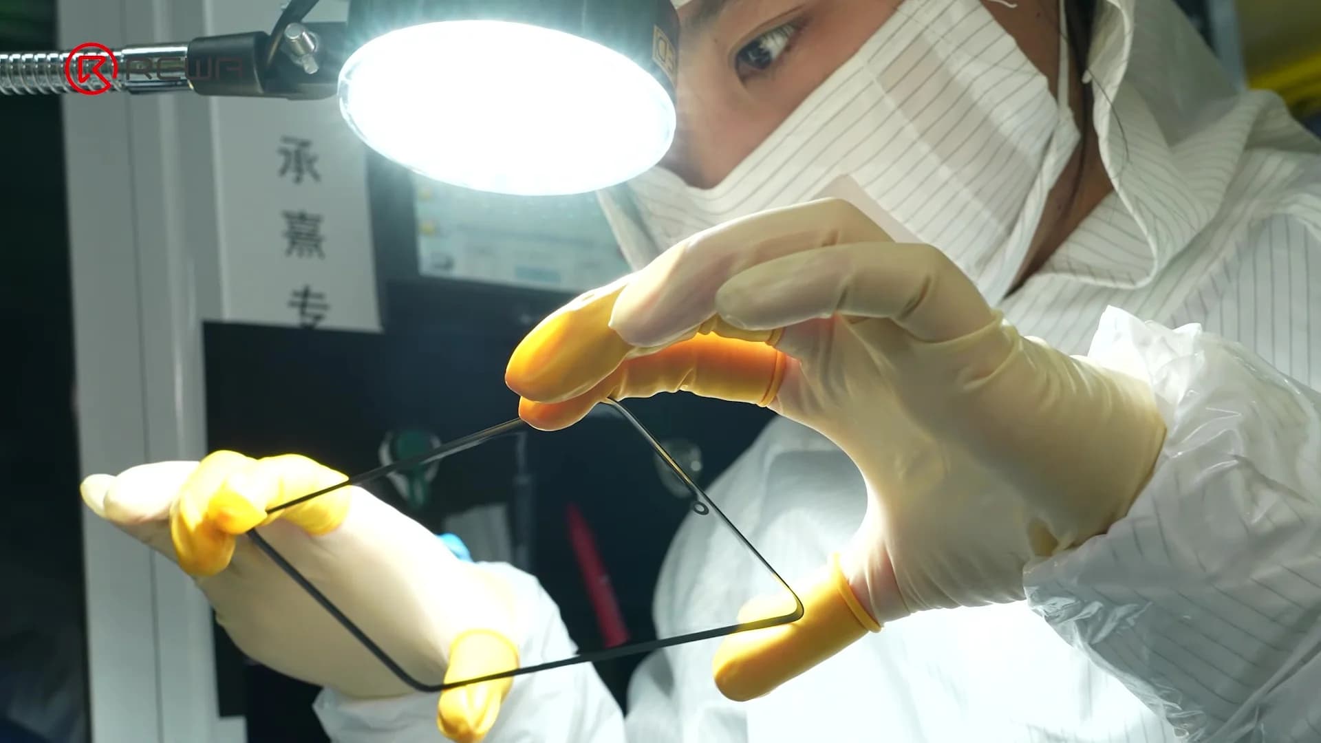 wearing mask a worker is inspecting samsung aftermarket screen