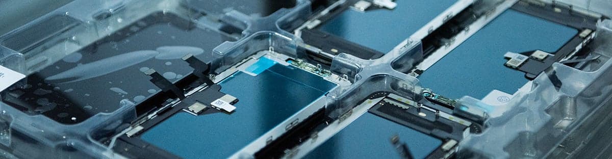 Close-up of blue electronic components used in phone screen and parts manufacturing