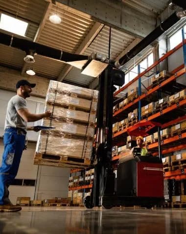 Warehouse worker managing battery inventory